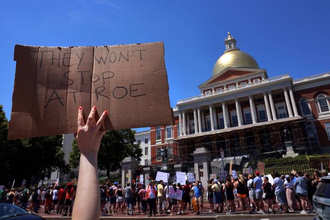 A person holds a sign during the pro-choice demonstration at the Massachusetts State House in Boston, MA
