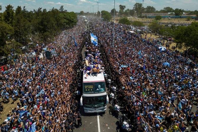 Millions of ecstatic fans are expected to cheer on their heroes as Argentina's World Cup winners led by captain Lionel Messi began their open-top bus parade of the capital Buenos Aires on Tuesday following their sensational victory over France.