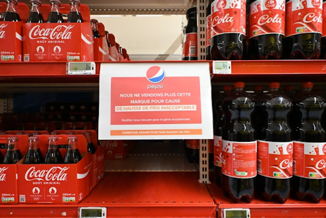 Coca-Cola on a store shelf with a no Pepsi sign