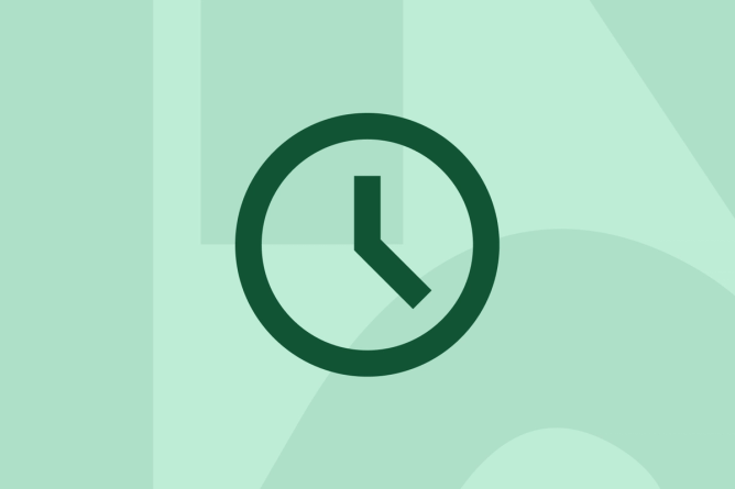 Green clock on a green background