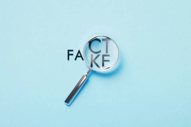 Image of a magnifying glass over the words fact/fake.