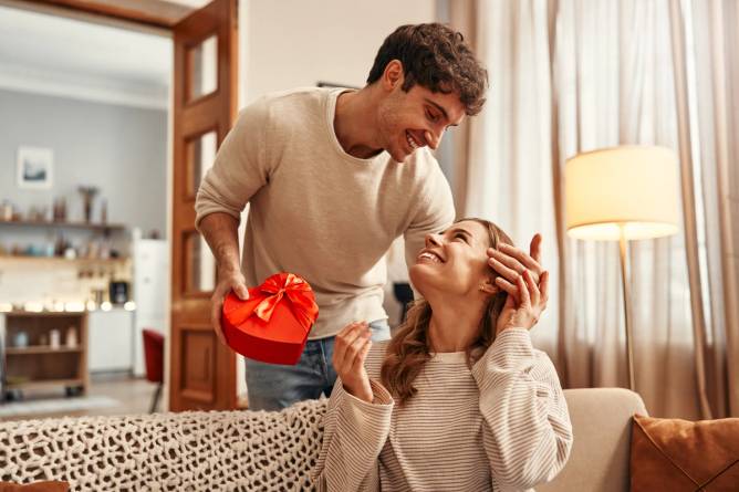 Couple exchanging Valentine's Day gifts