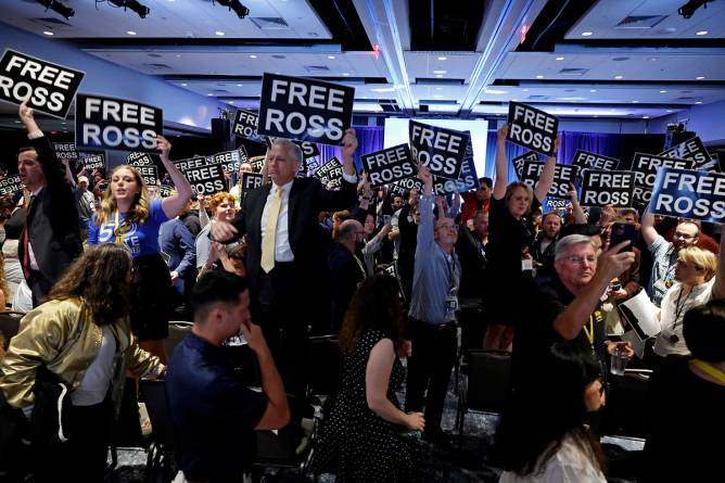 a group of protesters with "Free Ross" signs 