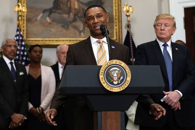 President Trump stands next to Johnny Taylor Jr. when he appointed Taylor Chairman Of White House Initiative Of Historically Black Colleges and Universities