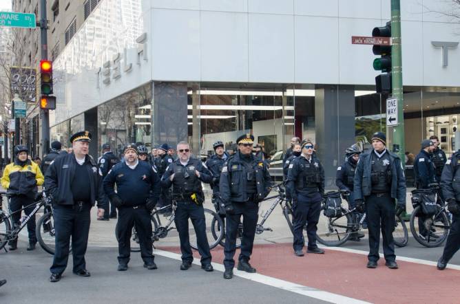 Police defend the Tesla showroom in Chicago. 