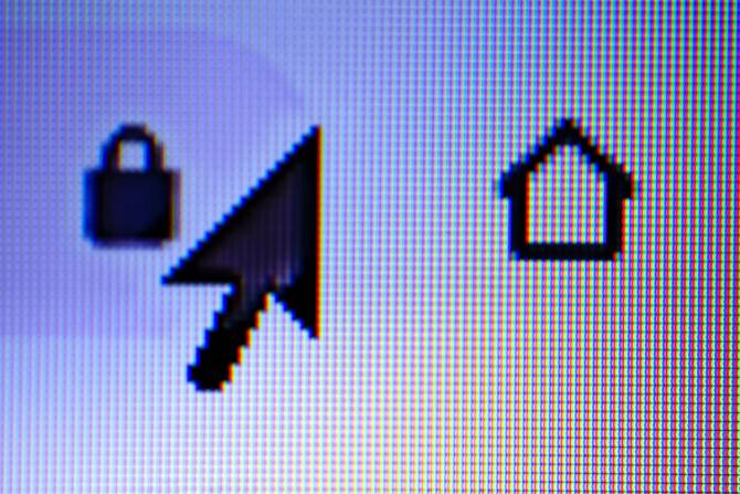 An close-up of a computer screen showing a cursor and the symbols for lock and home.