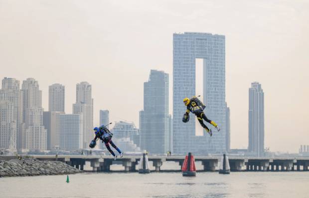 People racing on jet suits