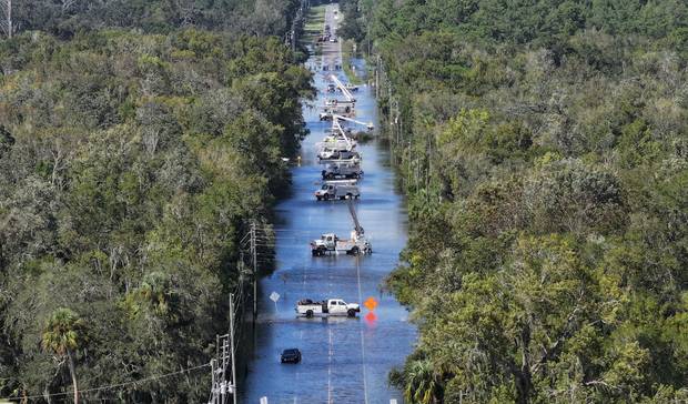 In this aerial view, power crews work on the lines after Hurricane Helene passed offshore on September 27, 2024 in Crystal River, Florida