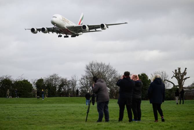 An aircraft struggles against the crosswinds as it comes into land at Heathrow airport