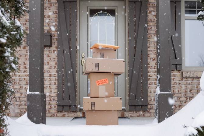 Packages on a doorstep in the snow