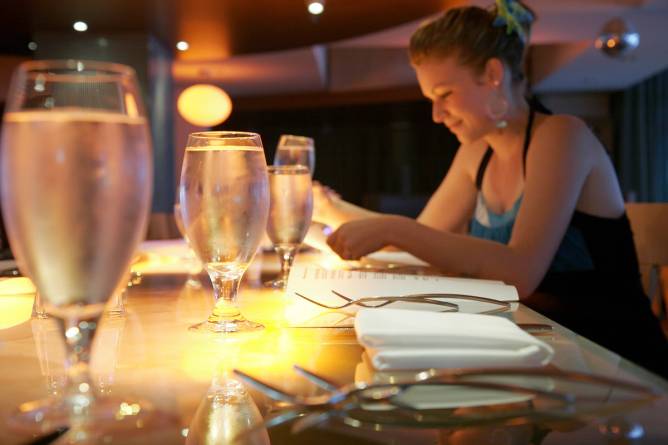 A woman eating alone at a restaurant