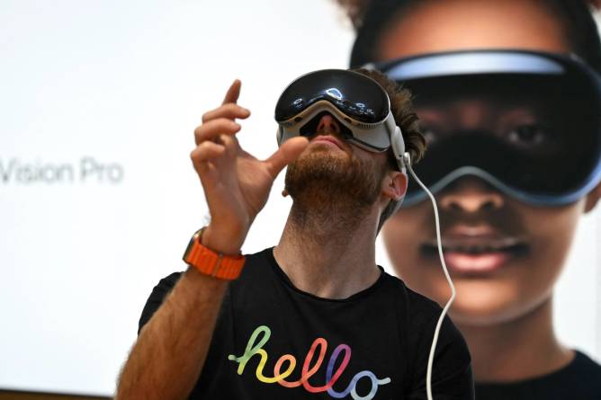 Image of a man wearing an Apple Vision Pro.