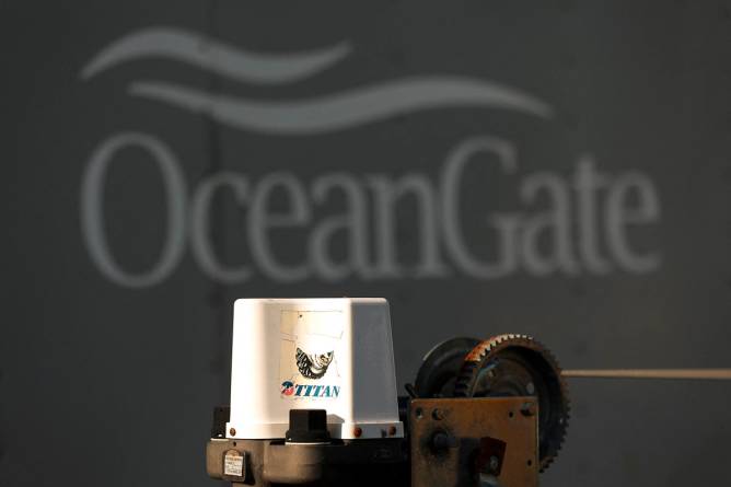 A decal on a piece of equipment which reads "Titan" is pictured near a trailer with the OceanGate logo at OceanGate Expedition's headqurters in the Port of Everett Boat Yard in Everett, Washington, on June 22, 2023.