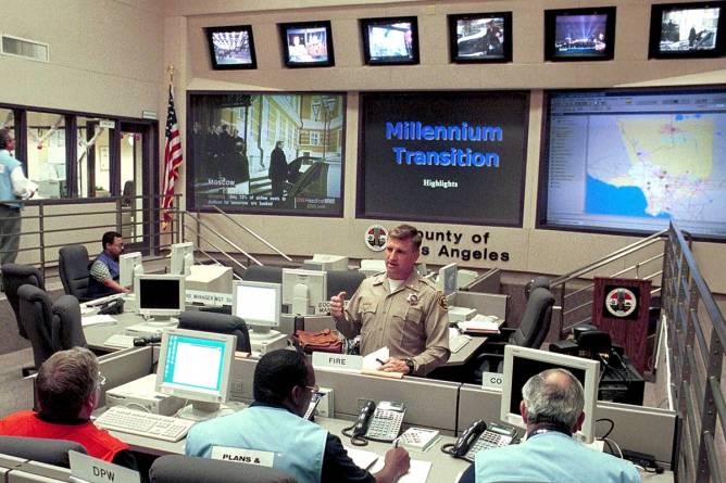 Personnel at the Los Angeles County Emergency Operations Center (EOC) monitor their stations to provide Y2K updates 31 December 1999 that may be needed through 03 January 2000. Credit: Jim Ruymen/Getty Images