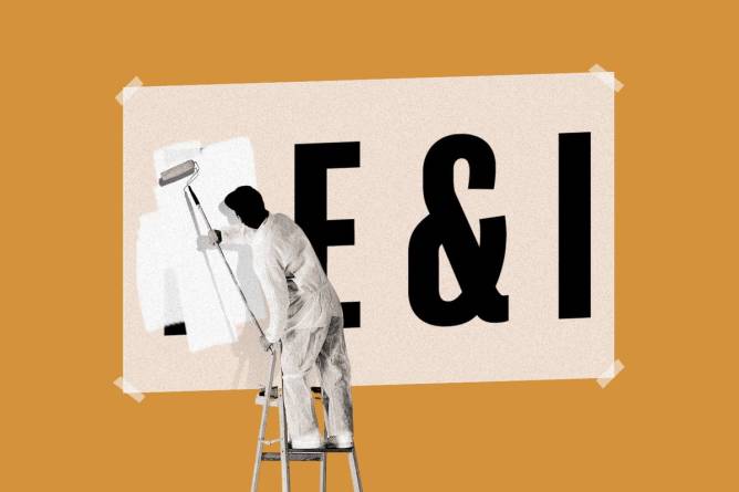 Painter covering up “D” in “DE&I”