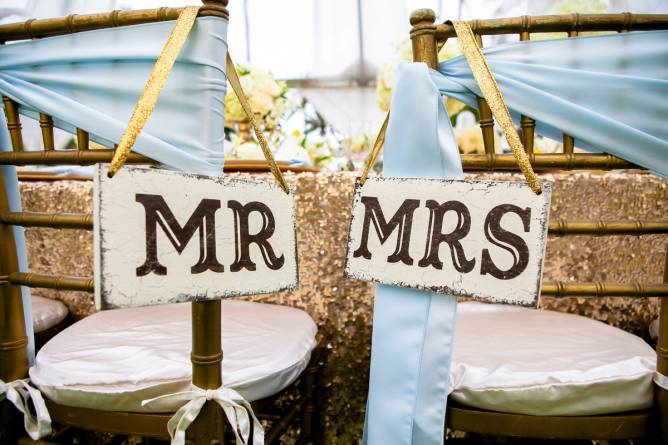 Chairs at a wedding labeled Mr. and Mrs.