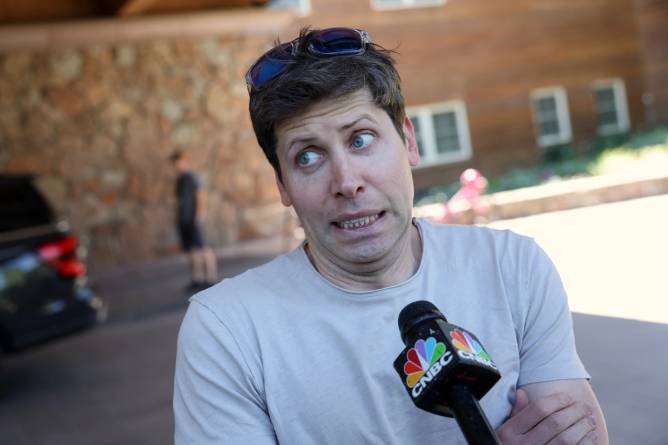 Image of Sam Altman grimacing in front of a news station microphone.