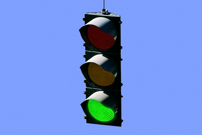 Animated gif of a traffic light with a dollar sign on red
