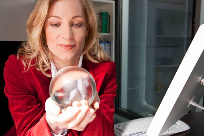 Businesswoman holding a crystal ball