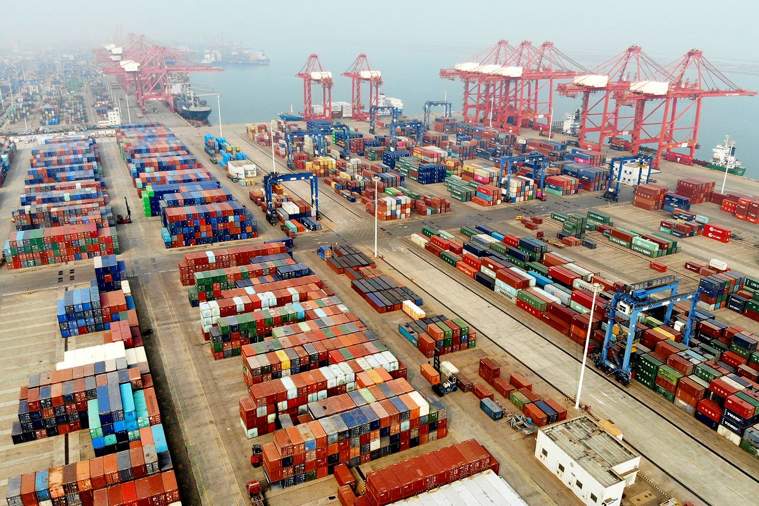 Aerial view of shipping containers sitting stacked at a port in China