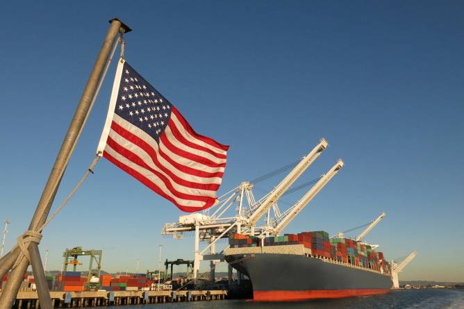 American flag hangs over a harbor