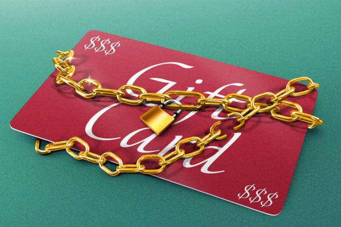 A photo illustration shows a plastic gift card with a lock and chain around it. 