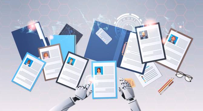 robot hands choosing resumes of business people to hire on a table of several laid out human resumes