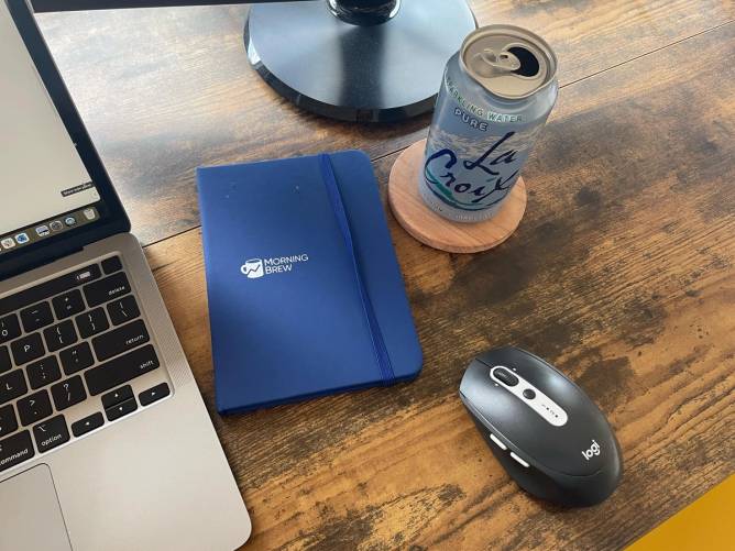 Tech Brew Editor Annie Saunders' tools of the trade, including a trusty Logitech wireless mouse.