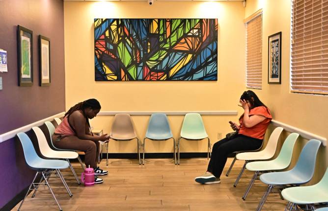 Women wait in the waiting room at Camelback Family Planning, an abortion clinic in Phoenix, Arizona