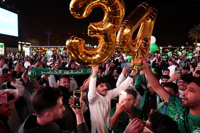 Members of the public celebrate as Saudi Arabia is announced as the host nation for the FIFA World Cup 2034 on December 11, 2024 in Riyadh, Saudi Arabia.