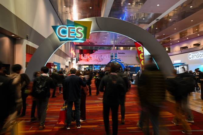 People wander the convention floor at CES