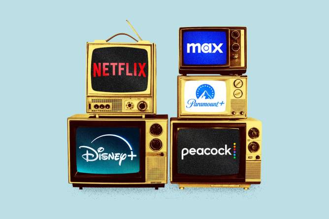 Logos of streaming services on stacked old tv boxes.