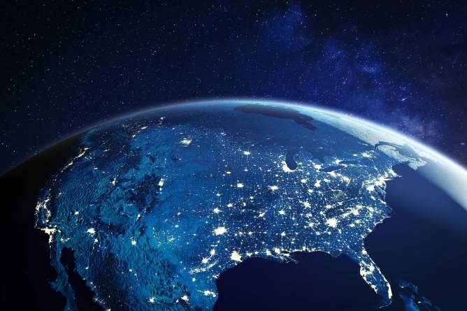 North America viewed from space with major U.S. cities highlighted.