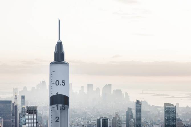 NYC skyline with the syringe standing in for the Empire State Building 
