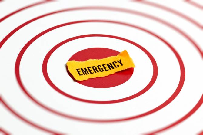 the word emergency is surrounded by red rings on a white background