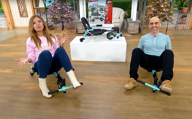 Ali Kermani (right) introduces the Razor Crazy Cart Shuffle on a July segment on QVC, where Jennifer Coffey (left) is a host.