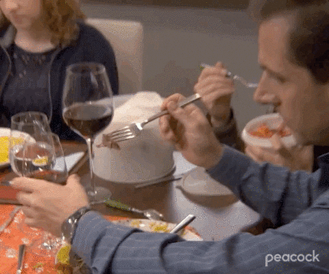 Michael Scott from the Office dipping steak into wine 