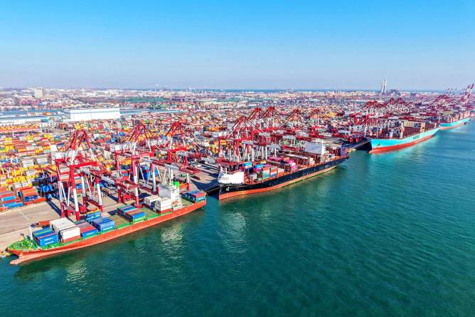 Cargo ships load and unload foreign trade containers at Qingdao Port, Shandong province, Feb 3, 2025.