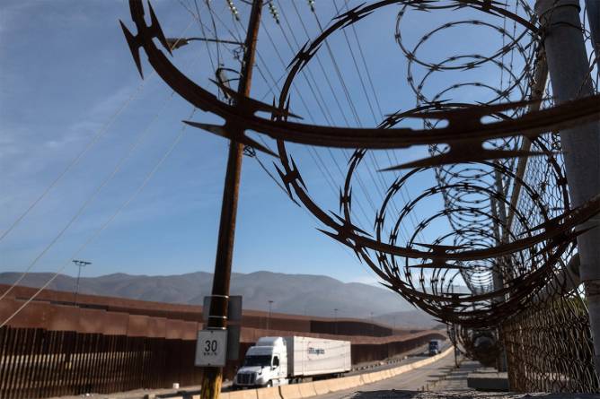 Truck at border, barbed wire