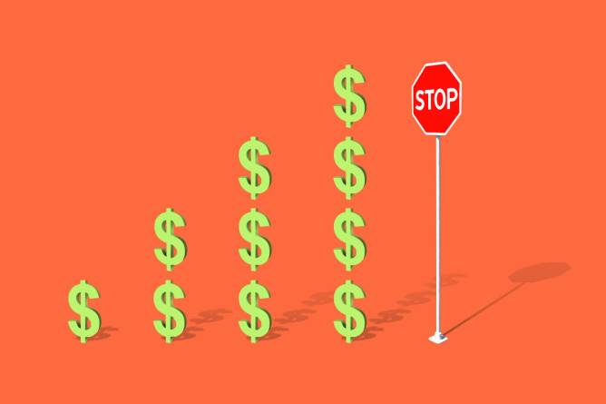 Increasing amount of dollar signs leading up to a stop sign.