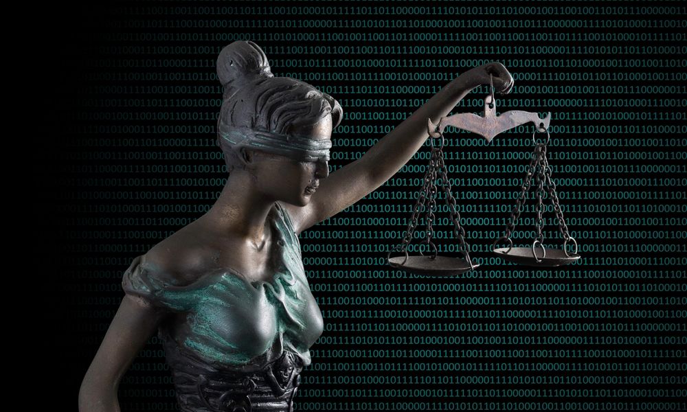 Lady Justice statue with binary code in background