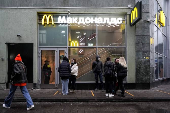 People wait outside of an McDonald's store in Moscow