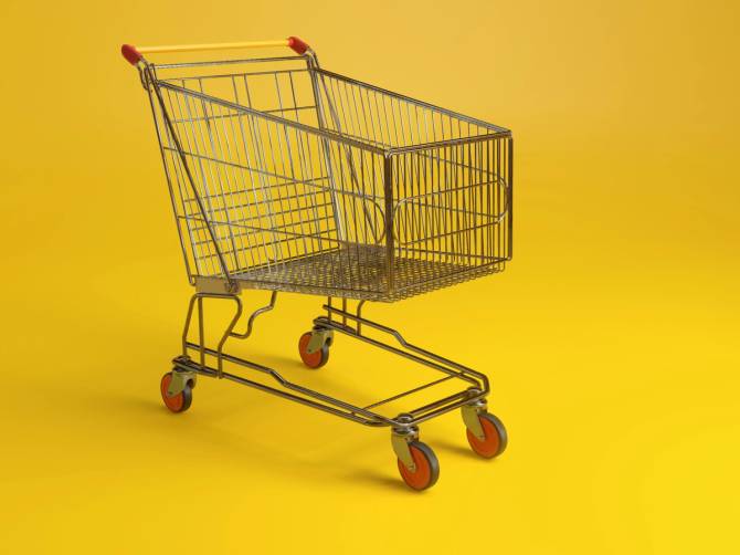 A shopping cart in front of a yellow background. 