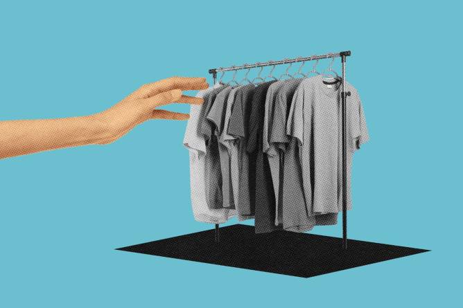 Hand reaching out to clothing rack
