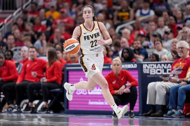 Caitlin Clark dribbling a basketball