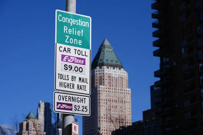 A sign with the toll prices for NYC congestion pricing