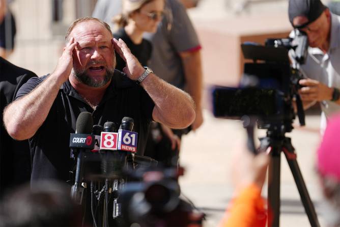 Infowars’ Alex Jones in front of microphones during press conference.