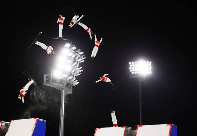 Qi Guangpu of Team China performs a trick on a practice run ahead of the Freestyle Skiing Mixed Team Aerials