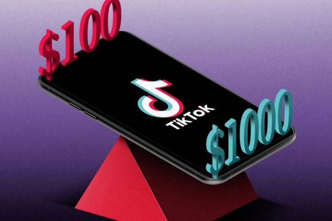 A phone displaying the TikTok logo on top of a seesaw with numbers weighing on either side