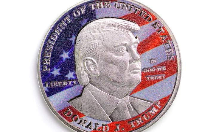 Donald Trump's face on a coin with an american flag